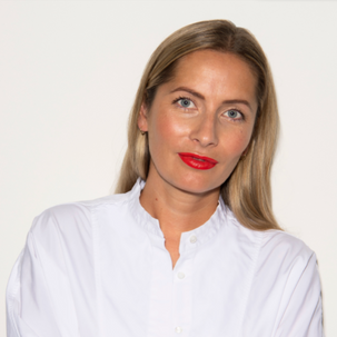 Woman wearing a white shirt with a plain background