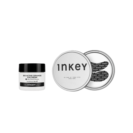 The Inkey Bio-Active Ceramide Eye Cream in a white jar with a black lid, shown next to a silver round tin displaying the product's packaging details on a solid white background.