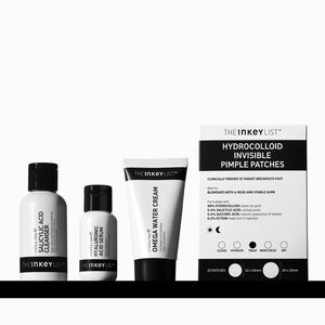 The Inkey List skincare products including cleanser, serum, water cream, and pimple patches on a white background.