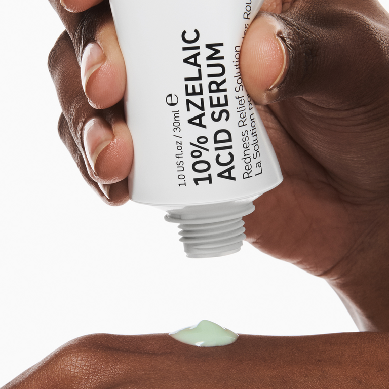 person squeezing Azelaic acid onto hand