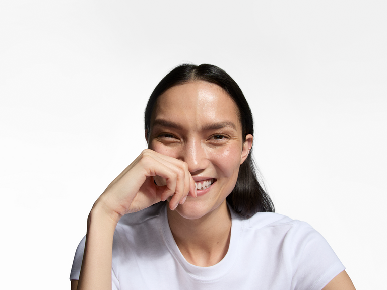 woman with hand over her face