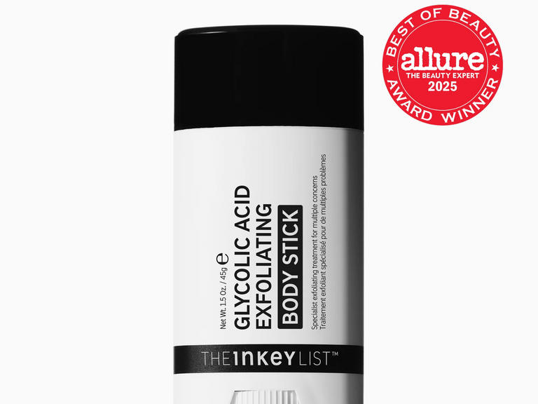 A white and black body stick container from The Inkey List, labeled Glycolic Acid Exfoliating Body Stick, with a red Allure Best of Beauty Award Winner badge in the top right corner.