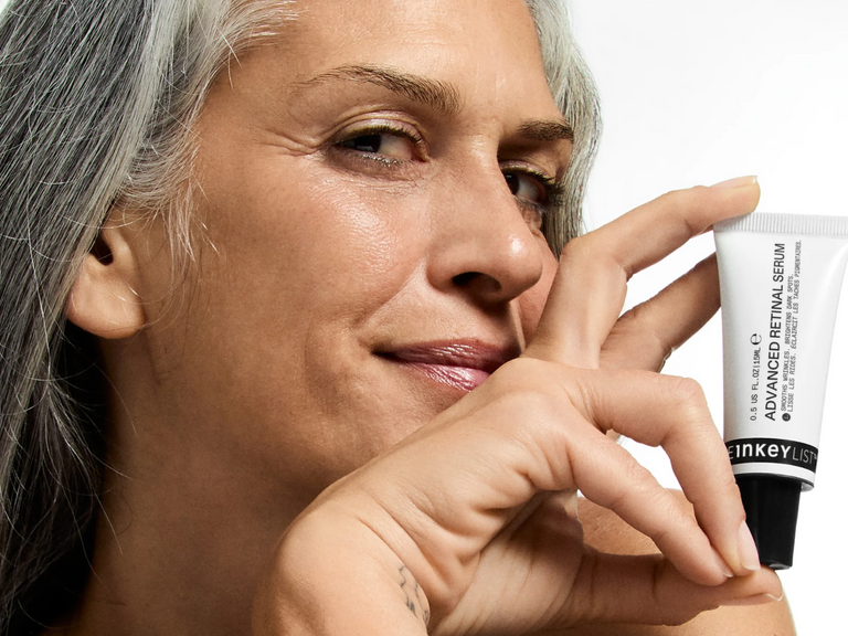 Woman holding retinol
