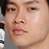 man holding serum bottle