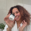 Woman applying BioActive moisturiser