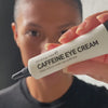 woman applying eye cream