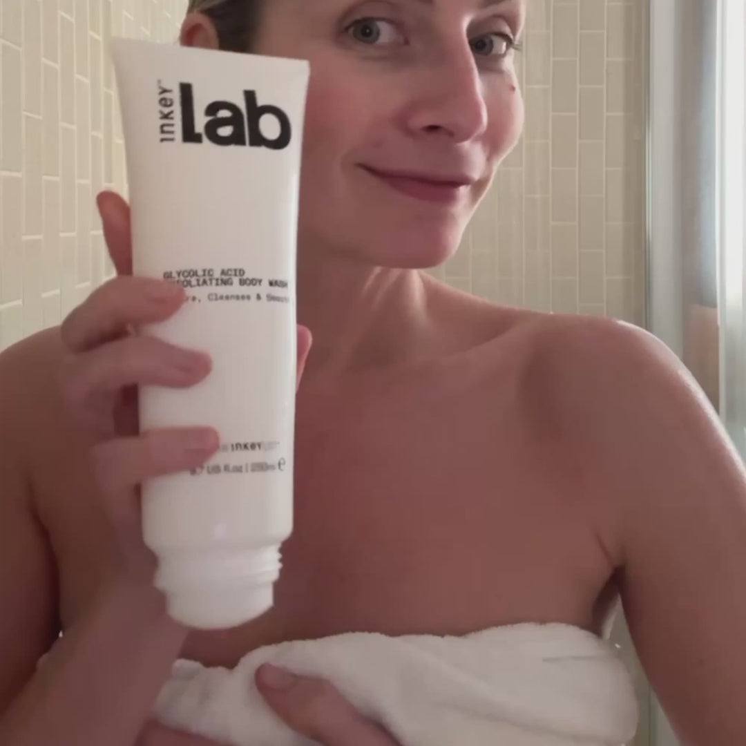 woman applying glycolic body wash