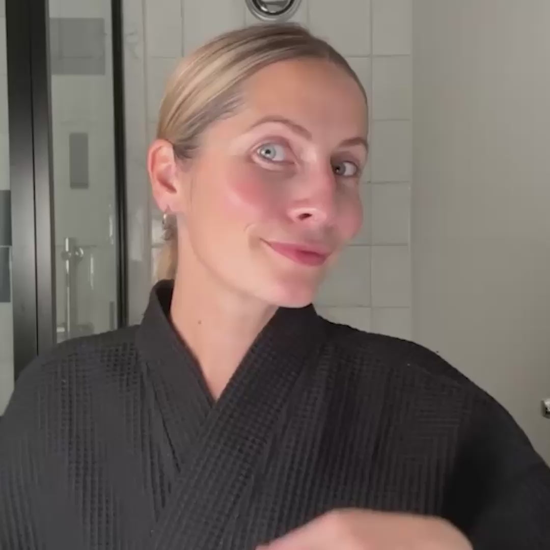 Woman applying retinol
