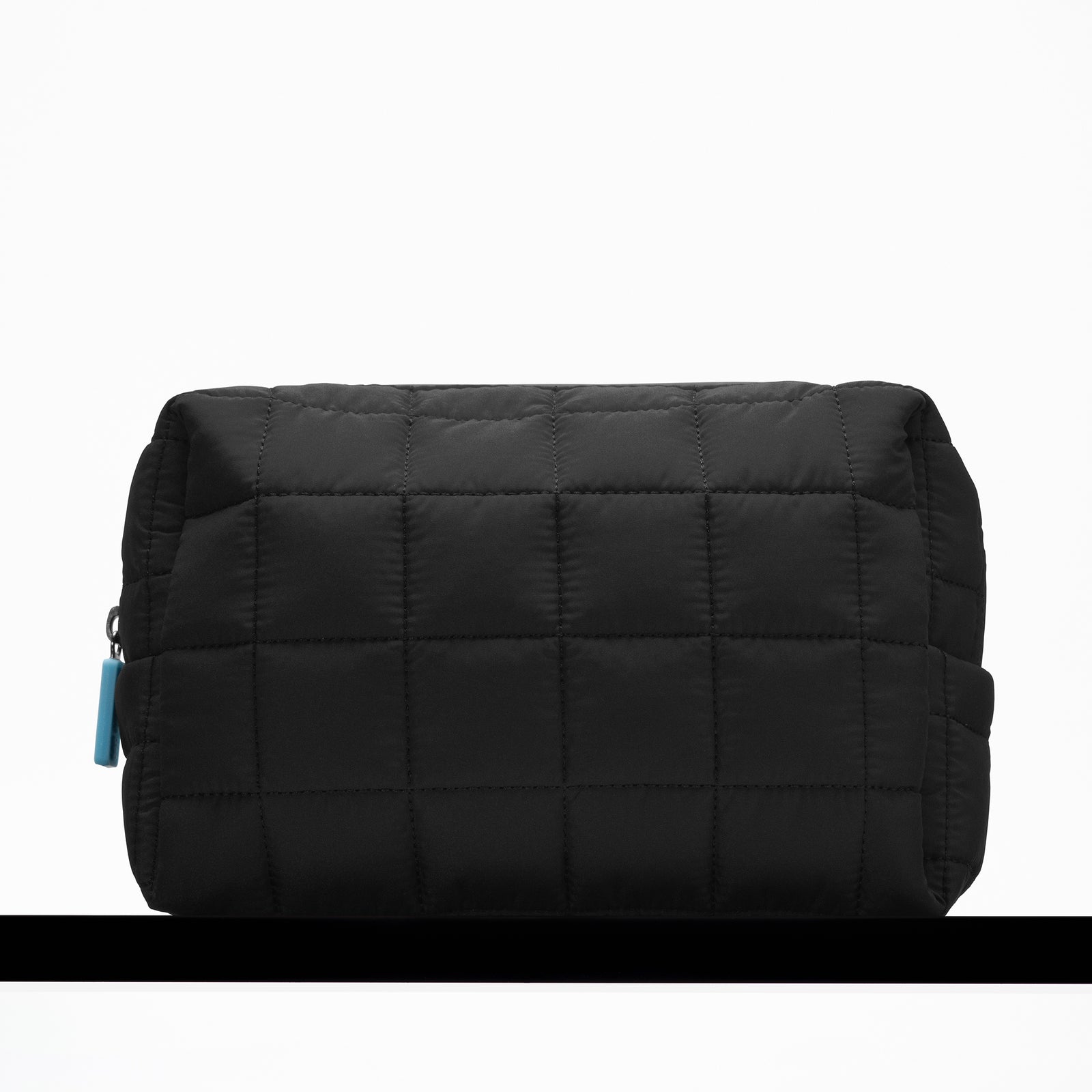 INKEY Wash Bag on black shelf 