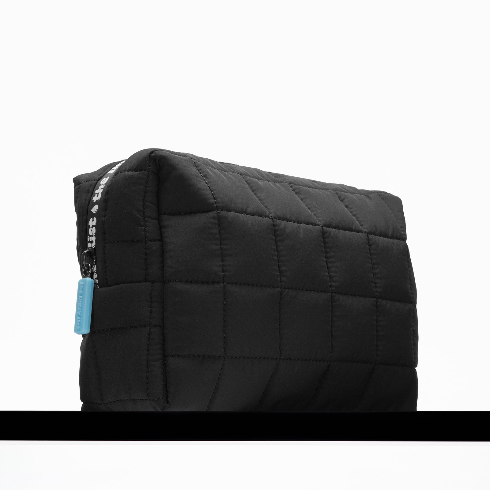 INKEY Wash Bag on black shelf 