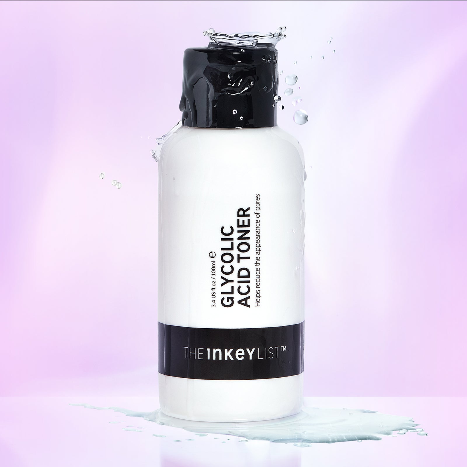 Glycolic Acid Toner product against a purple background with toner dripping down the bottle