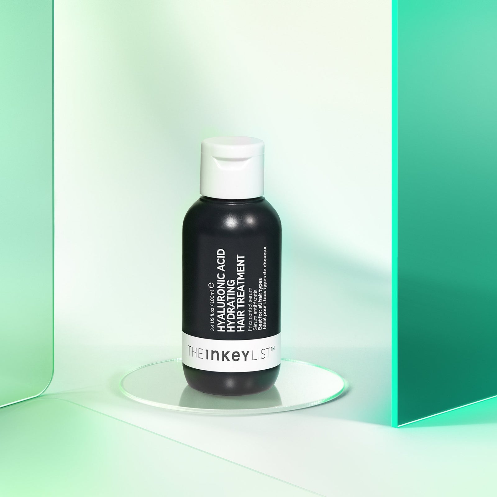Hyaluronic Acid Hydrating Hair Treatment product against a green glossy background