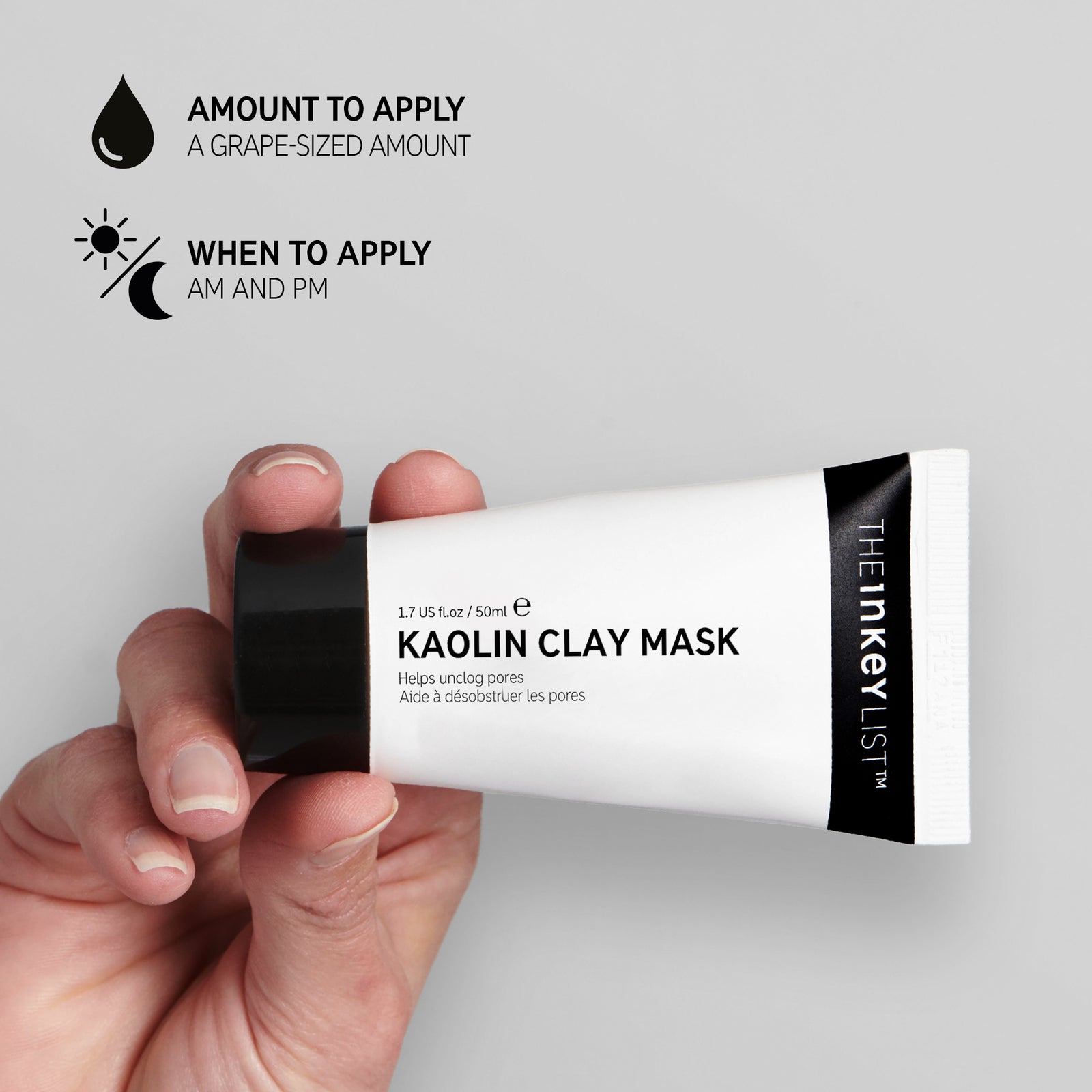 Hand holding a tube of Kaolin Clay Mask against a grey background with black text explaining how and when to use it