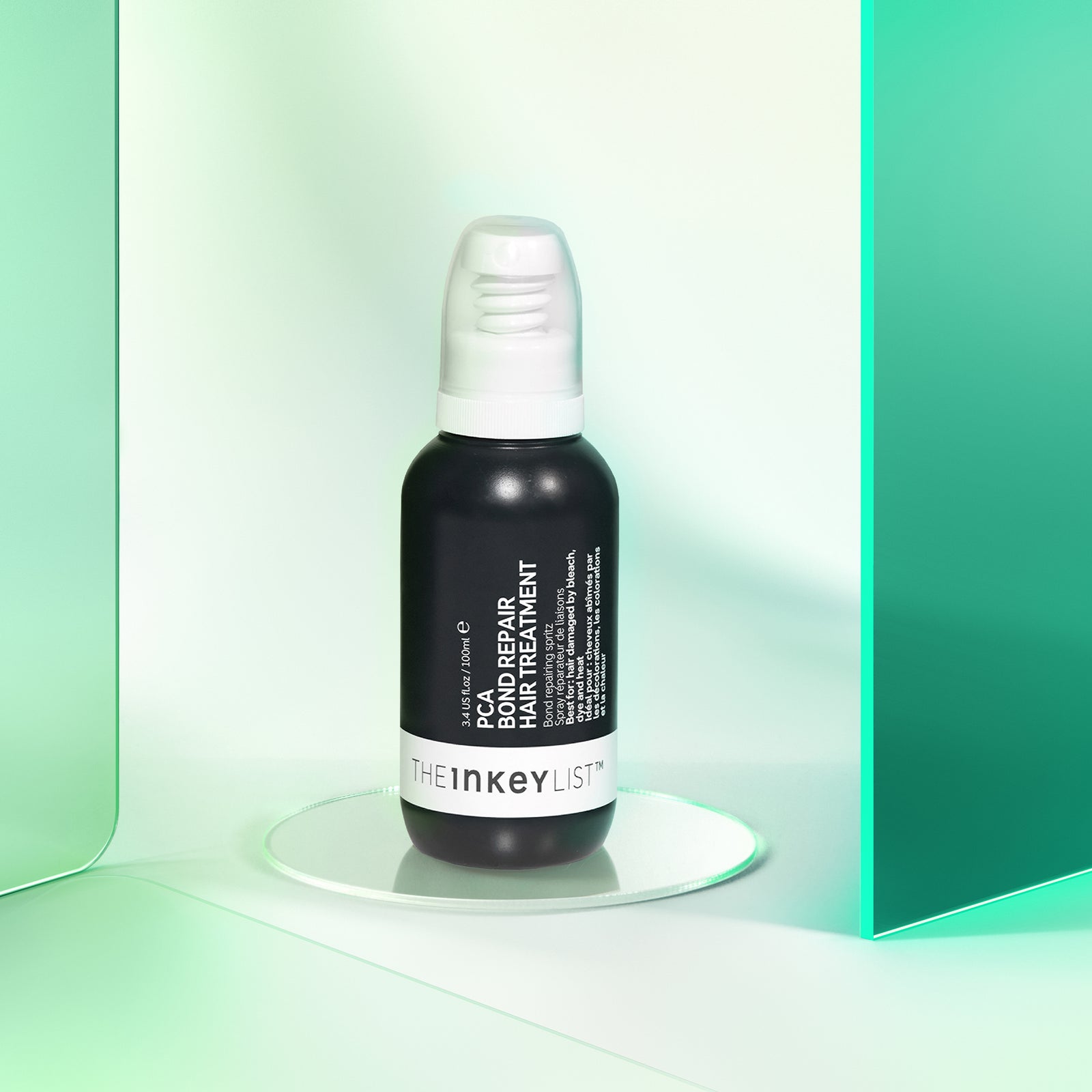PCA Bond Repair Hair Treatment product against a glossy green background