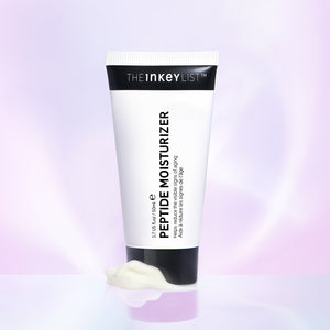 Peptide Moisturiser product against a purple background with some moisturiser at the base of the tube